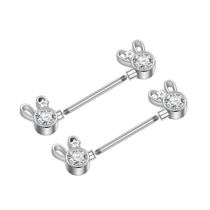 Detail of silver nipple rings with mouse head zircon studs and threaded steel bars