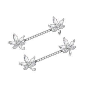 Macro shot of maple leaf nipple rings with shimmering cubic zirconia in 316L surgical steel
