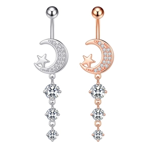 Detail of moon and star navel rings in silver and rose gold with sparkling cubic zirconia
