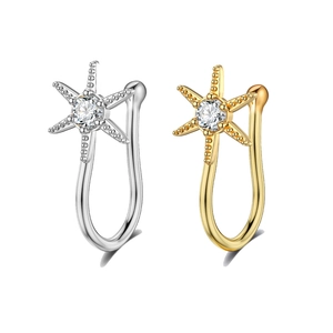 Detailed view of silver and gold starfish non-piercing nose clips with crystal inlay