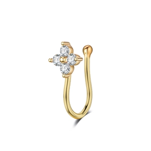 Detail of non-pierced gold nose clip featuring a four-petal flower with zircon stones