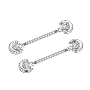 Detailed close-up of crescent-shaped nipple rings with clear cubic zirconia in silver steel