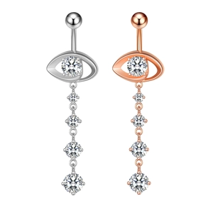Detail of silver and rose gold eye-shaped belly rings with sparkling zircon crystals