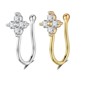 Close-up of gold and silver non-pierced U-shaped nose rings with crystal flower design