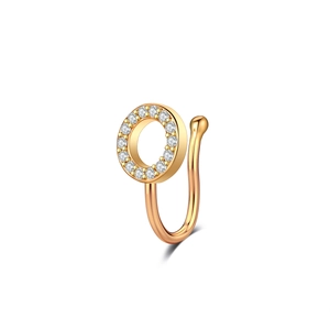 Detail of a U-shaped gold non-piercing nose ring with sparkling round zircon stones