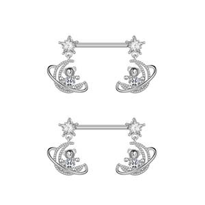 Detail of star and moon bear charms on silver nipple rings with sparkling cubic zirconia