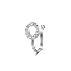 Close-up of a silver non-pierced U-shaped nose ring featuring a crystal-set circular charm