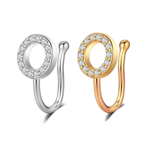 Detailed close-up of U-shaped non-piercing nose clips in gold and silver finish with zircon