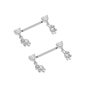 Detail view of silver nipple rings featuring heart zircon and cute 3D bear charms