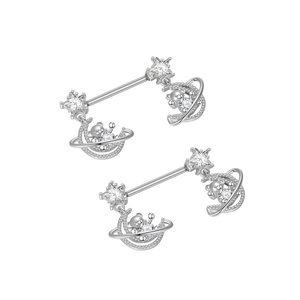 Detail view of silver nipple rings featuring star and moon charms with zircon teddy bears