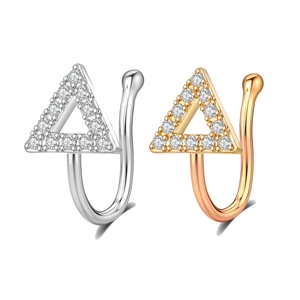 Detailed macro view of two triangular non-pierced nose clips with sparkling zircon inlay
