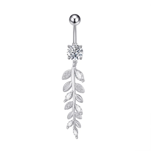 Detailed view of curved silver navel ring with large round zircon and leafy charm