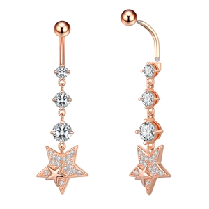 Macro view of rose gold navel ring with crystal star pendant and detailed screw structure