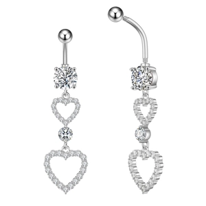 Macro detail of silver navel ring with double heart design and sparkling zircon stones
