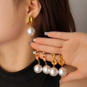 Snake shape titanium steel pearl earrings with gold plating and red gemstones