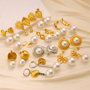 Luxurious 18K gold plated stainless steel earring set with pearls on white silk backdrop