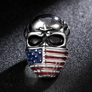 Vintage stainless steel skull ring with American flag mask design on a black background