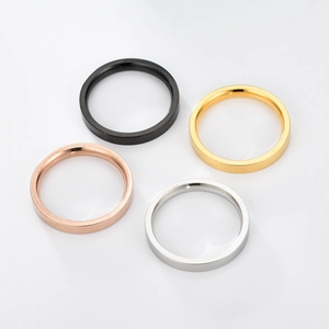 Flat lay of 3mm stainless steel rings in black, gold, rose gold and silver colors