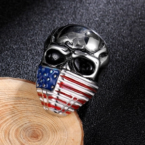 Macro shot of silver stainless steel skull ring with colorful American flag face pattern