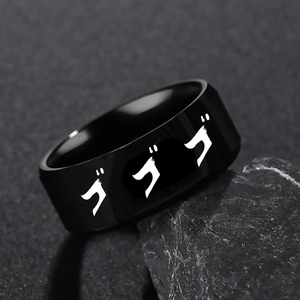 Matte black stainless steel JoJo anime ring with white 'Gogogo' text on rock surface