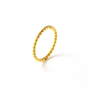 Detailed view of an 18K rose gold twisted rope ring with a polished metallic finish