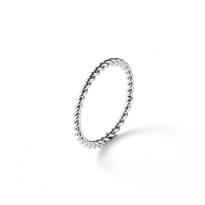 Detailed view of the twisted rope texture on a minimalist silver polished steel ring