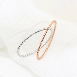 Elegant 18K rose gold and silver rope twist rings with minimalist minimalist aesthetic