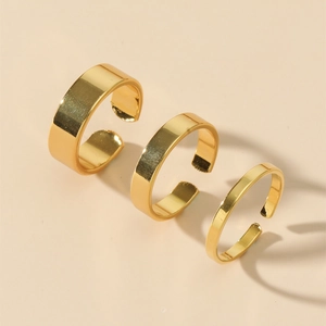 Three-piece set of minimalist golden C-shaped open rings with polished mirror finish