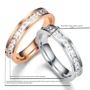 Detail of 4mm titanium steel rings with channel-set square zircons in gold and silver