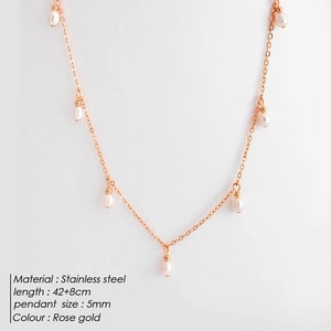 Rose gold stainless steel necklace with evenly spaced 5mm white pearls
