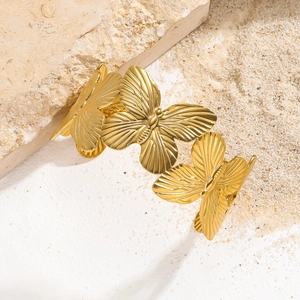 Minimalist gold butterfly open bangle bracelet with textured metal wings for women