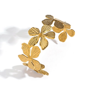 Polished 18k gold plated stainless steel floral open bangle with textured petal design