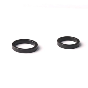 Minimalist matte black ceramic texture rings for couples featuring a sleek plain band