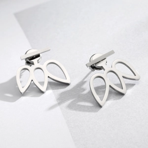 Detailed view of hollow geometric stainless steel ear jacket earrings in silver finish
