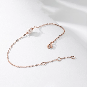 Minimalist 14K rose gold plated stainless steel bracelet with a single natural white pearl