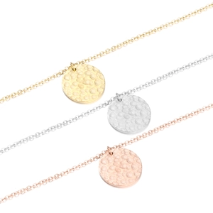 Three minimalist stainless steel disc necklaces with hammered texture in gold, silver, rose gold