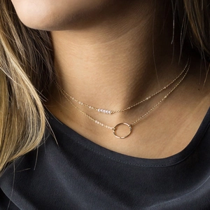 Elegant 316L gold double layer necklace with white pearls and polished circular pendant