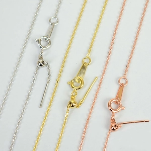 Detailed view of adjustable stainless steel chains with slide beads in three colors