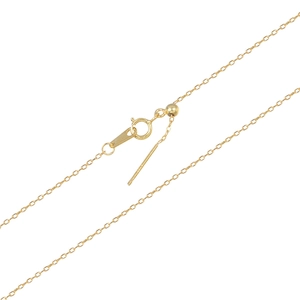 Detailed macro of gold adjustable anklet chain with slide bead and pin needle end