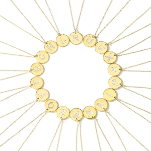 Golden 316L stainless steel necklace featuring hammered round letter shell pendants