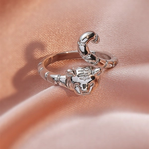 Cute 18KGP tiger head open ring with adjustable snake bone band on pink silk background