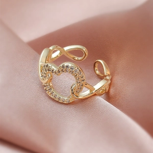 Exquisite gold-plated overlapping heart ring with shimmering crystal accents for women