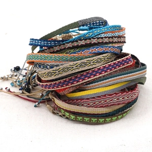 Handmade bohemian woven friendship bracelet set with ethnic geometric patterns in vibrant colors