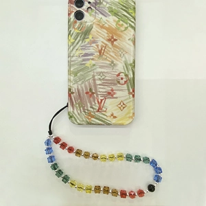 Rainbow beaded wristlet strap with a colorful monogram patterned mobile phone case