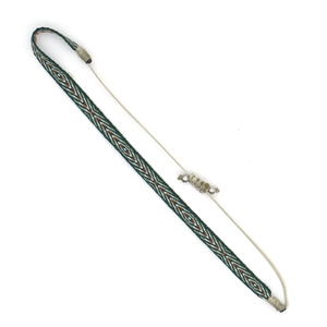 Detailed view of bohemian woven bracelet featuring green and orange geometric patterns