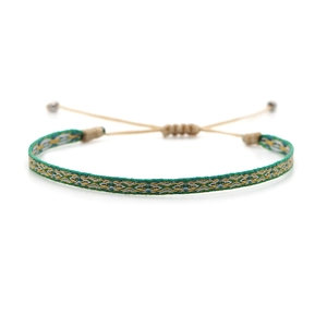 Detail view of Bohemian hand-woven bracelet featuring colorful geometric diamond patterns