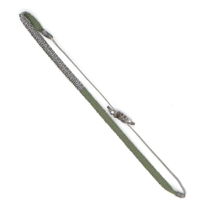 Detail of bohemian olive green hand-woven adjustable bracelet with silver sliding beads