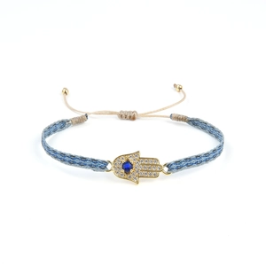 Bracelet tressé Hamsa ethnique avec pierres bleues et zircons étincelants