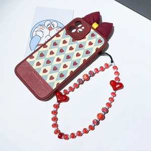 Red heart checkerboard phone case with beaded wrist strap and red fabric bow detail