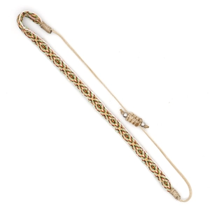 Detail of bohemian woven bracelet with geometric patterns and adjustable cord closure